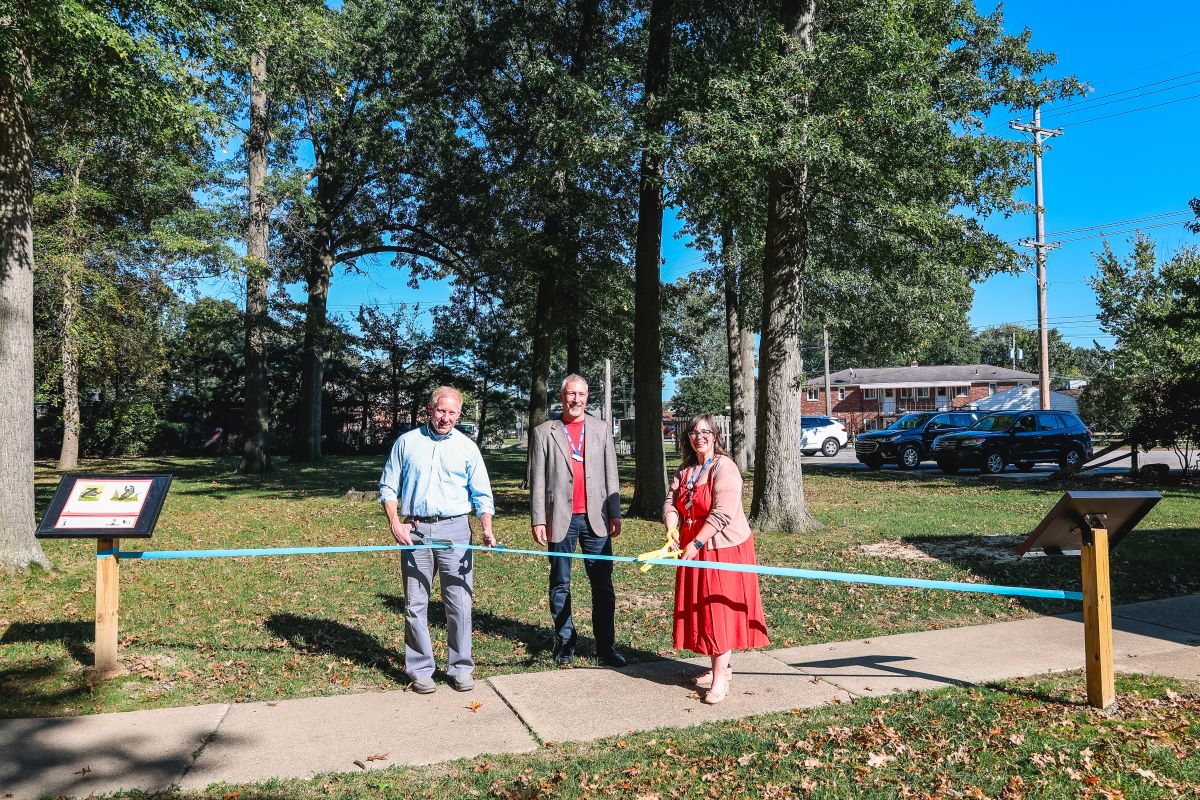 Pictured: Mayor Don Walters, Library Director Andrew Harant, Library Children’s Manager Amy Galluch perform a ribbon cutting on the new StoryWalk®.